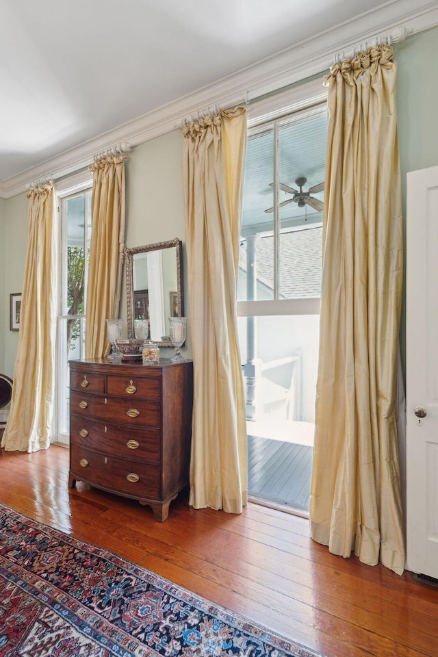 bedroom featuring crown molding and hardwood / wood-style flooring