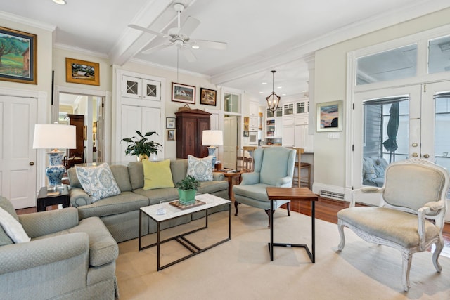 living area featuring ornamental molding, ceiling fan with notable chandelier, light wood-type flooring, and recessed lighting