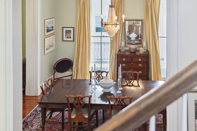 dining room featuring a chandelier and wood finished floors