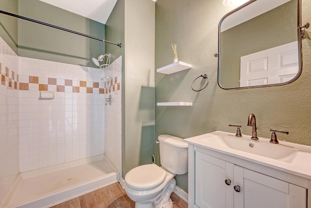 130 River Landing Dr Unit 2310, Daniel Island, SC 29492 - full bath featuring tiled shower, toilet, wood finished floors, vanity, and a textured wall