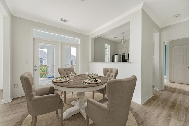 130 River Landing Dr Unit 2310, Daniel Island, SC 29492 - dining space featuring light wood-style flooring, ornamental molding, and baseboards