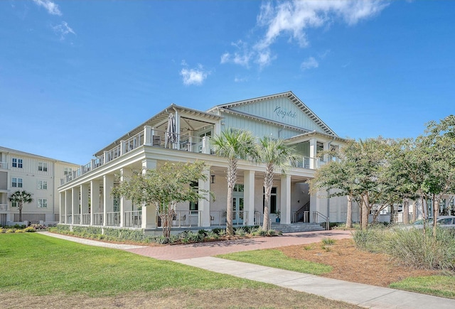 130 River Landing Dr Unit 2310, Daniel Island, SC 29492 - view of front of house featuring covered porch, a balcony, and a front lawn