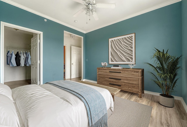 130 River Landing Dr Unit 2310, Daniel Island, SC 29492 - bedroom featuring wood finished floors, baseboards, a closet, and crown molding