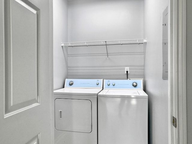 clothes washing area with independent washer and dryer