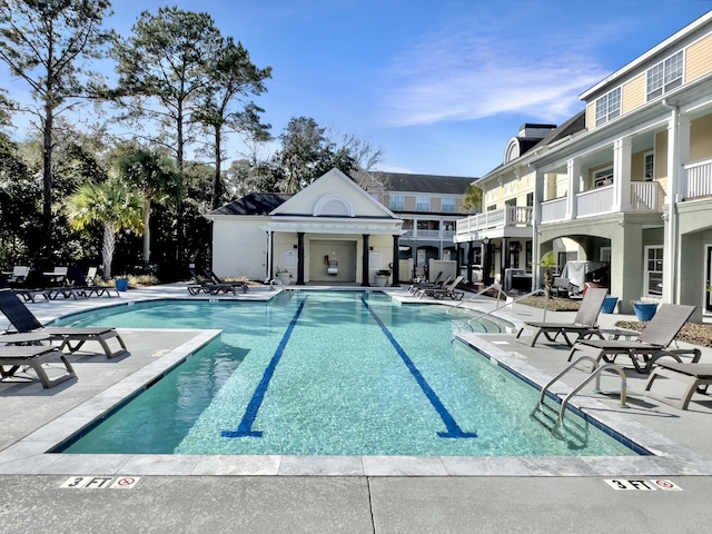 view of swimming pool featuring a patio area