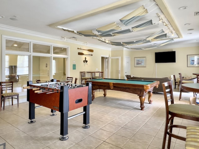 rec room with crown molding, a tray ceiling, light tile patterned floors, and billiards