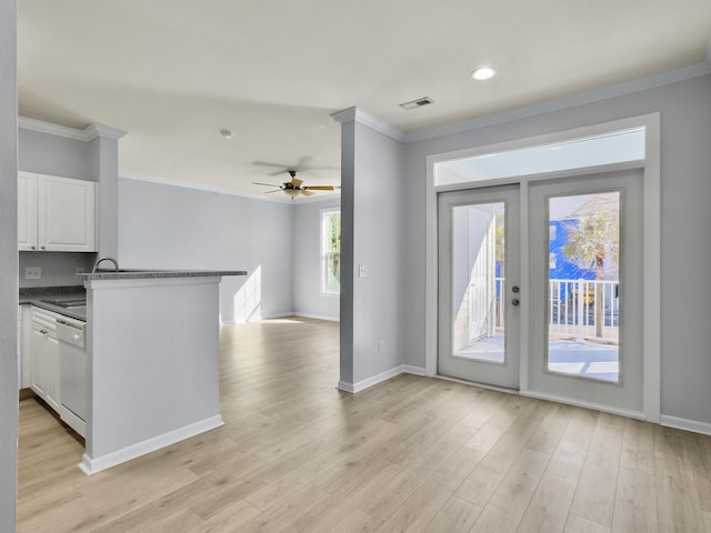 kitchen with white cabinetry, sink, white dishwasher, kitchen peninsula, and crown molding