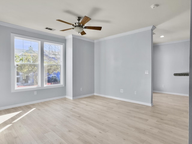 spare room featuring crown molding, ceiling fan, and light wood-type flooring