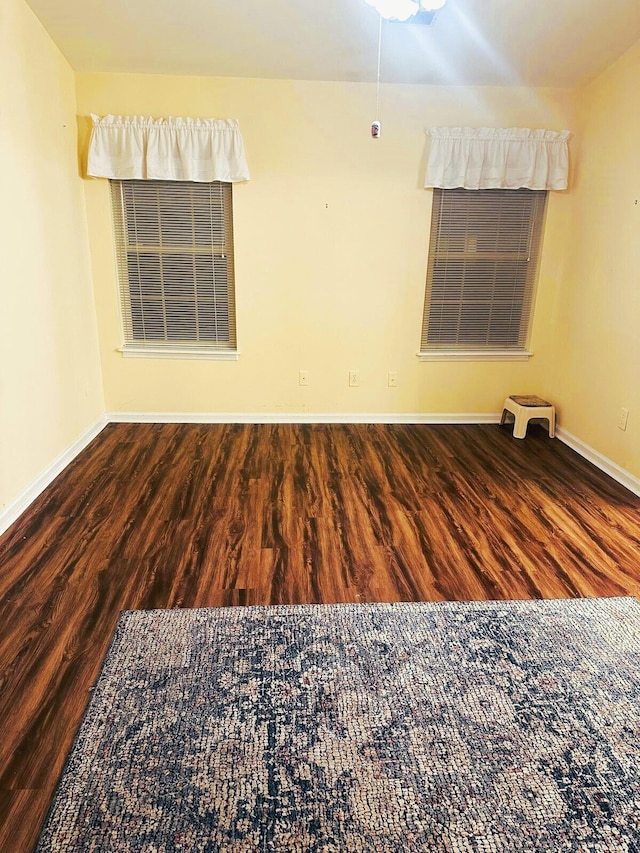 unfurnished room featuring dark hardwood / wood-style flooring