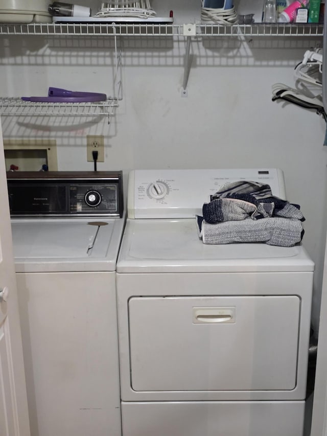 laundry area with separate washer and dryer