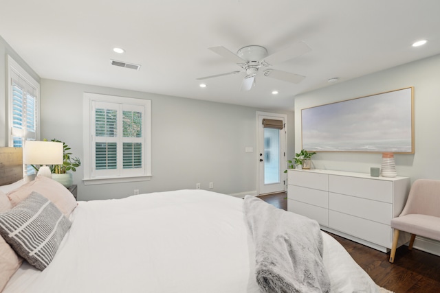 bedroom with ceiling fan, dark hardwood / wood-style flooring, and access to outside