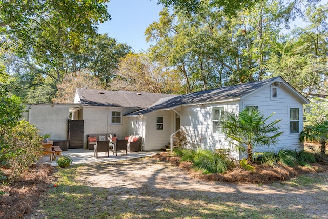 back of property featuring a patio