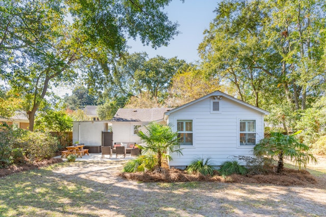 back of property featuring a patio area