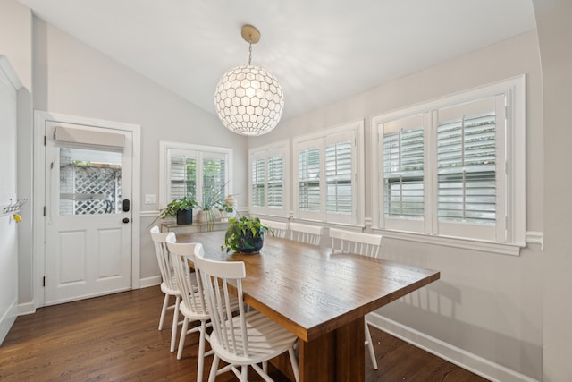 dining space featuring dark hardwood / wood-style floors and lofted ceiling