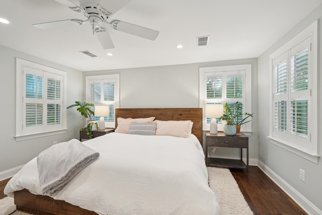 bedroom with dark wood-type flooring and ceiling fan