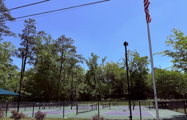 view of sport court with fence