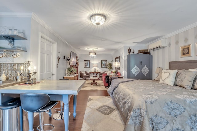 bedroom featuring wood-type flooring, sink, ornamental molding, and a wall unit AC