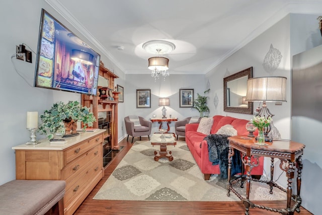 living room with ornamental molding and hardwood / wood-style flooring