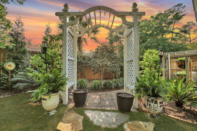 patio terrace at dusk with a pergola