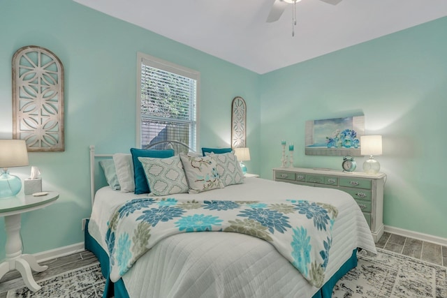 bedroom with wood-type flooring and ceiling fan