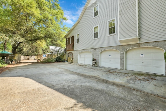 view of side of home featuring a garage