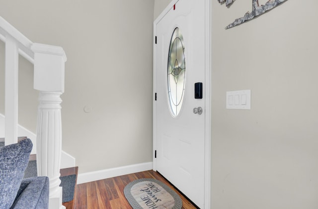 foyer entrance with dark hardwood / wood-style flooring