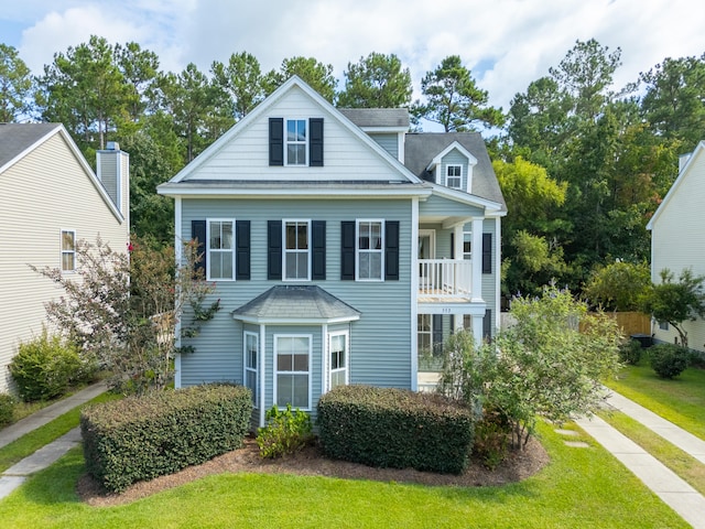 view of front of property with a balcony