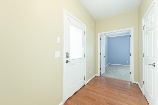 hall with light wood-type flooring