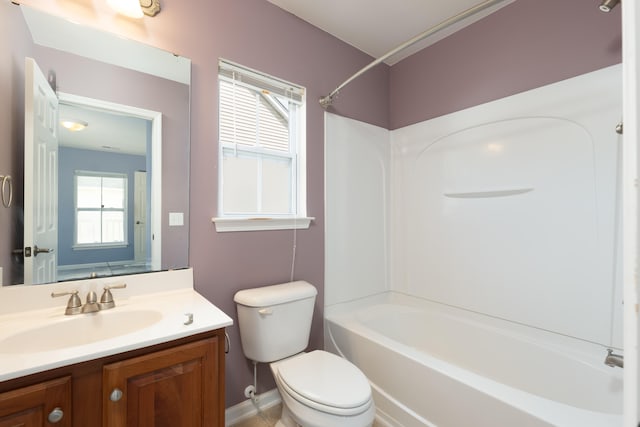 full bathroom with shower / bathing tub combination, a wealth of natural light, vanity, and toilet