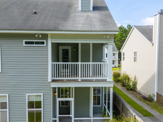 rear view of house featuring a balcony