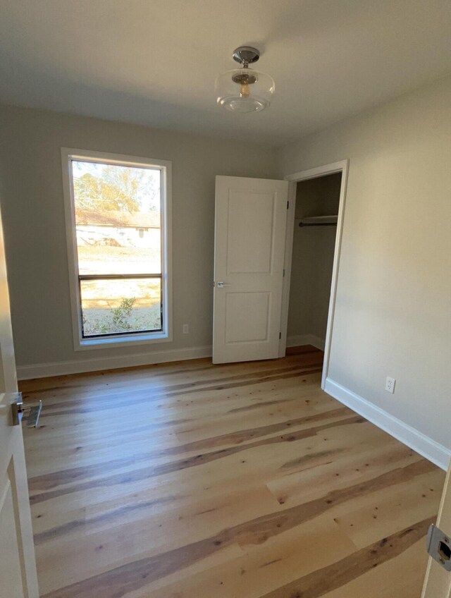222 Braly Dr, Summerville, SC 29485 - unfurnished bedroom featuring a closet and light wood-type flooring