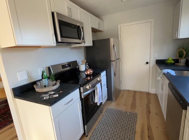 222 Braly Dr, Summerville, SC 29485 - kitchen featuring white cabinetry, stainless steel appliances, and light hardwood / wood-style floors