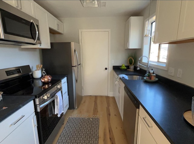222 Braly Dr, Summerville, SC 29485 - kitchen featuring stainless steel appliances, sink, white cabinets, and light hardwood / wood-style floors