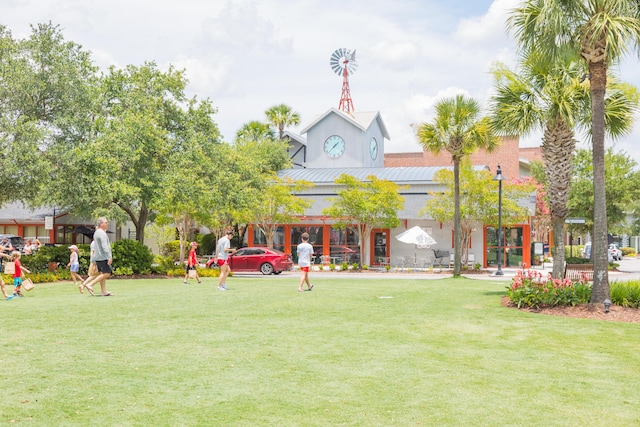 view of home's community with a lawn