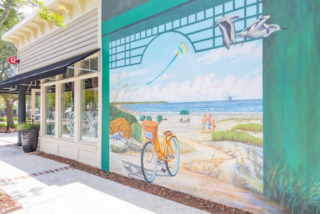 exterior space featuring a view of the beach and a water view