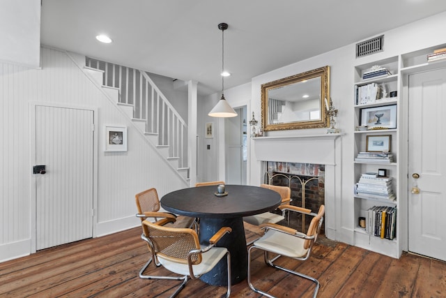 176 Smith St, Charleston, SC 29403 - dining space featuring wood finished floors, stairway, a fireplace, and recessed lighting