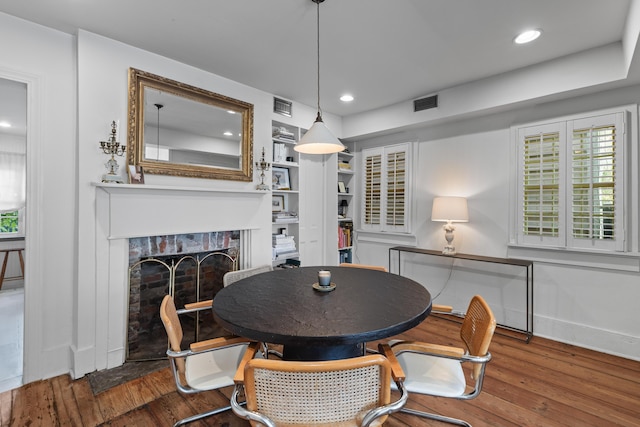 176 Smith St, Charleston, SC 29403 - dining room featuring hardwood / wood-style flooring, a fireplace, and recessed lighting