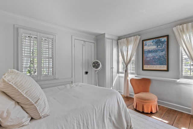 176 Smith St, Charleston, SC 29403 - bedroom featuring crown molding, wood finished floors, and a closet