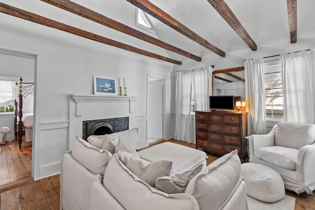 176 Smith St, Charleston, SC 29403 - living room featuring beam ceiling, wood-type flooring, and a fireplace