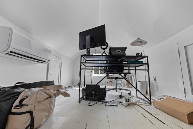 176 Smith St, Charleston, SC 29403 - bedroom with a wall mounted AC, an office area, wood finished floors, and lofted ceiling