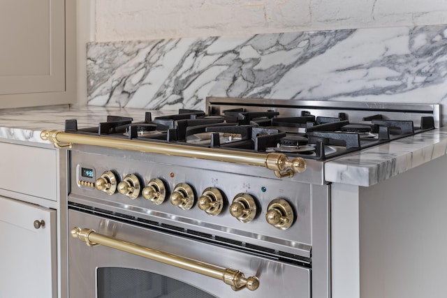 176 Smith St, Charleston, SC 29403 - kitchen view of high end stainless steel range and tasteful backsplash