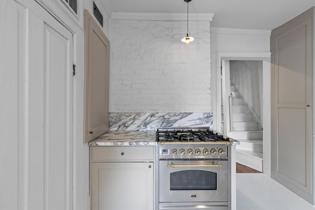 176 Smith St, Charleston, SC 29403 - kitchen with stainless steel appliances, hanging light fixtures, light stone countertops, ornamental molding, and tasteful backsplash