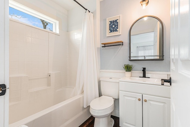 full bathroom featuring vanity, wood-type flooring, shower / bath combo, and toilet