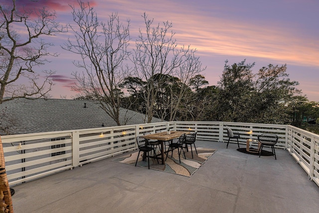 view of patio terrace at dusk