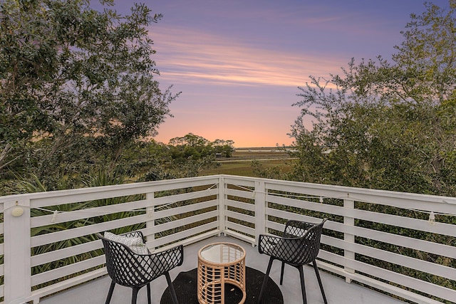 view of balcony at dusk