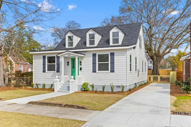 cape cod house with roof with shingles, crawl space, a front yard, and fence