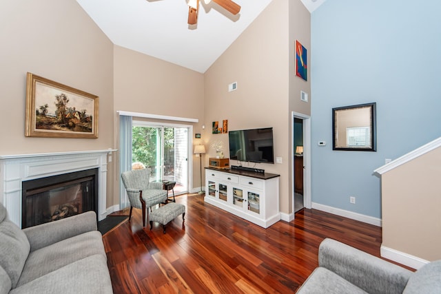 living room with dark wood-type flooring, high vaulted ceiling, and ceiling fan