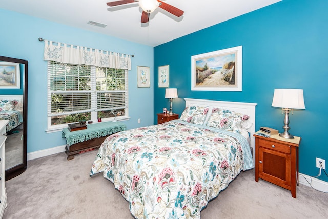 bedroom featuring ceiling fan and light carpet