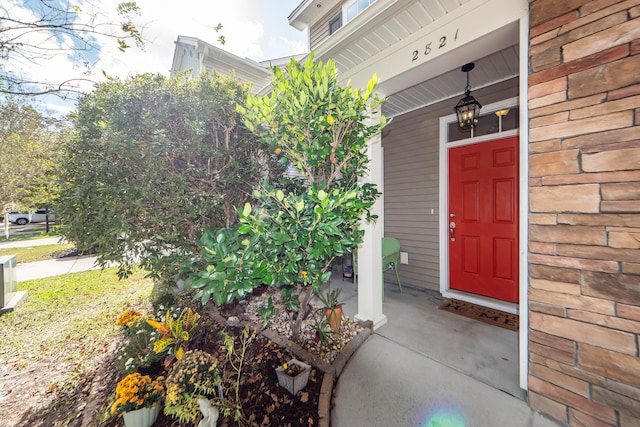 property entrance featuring covered porch