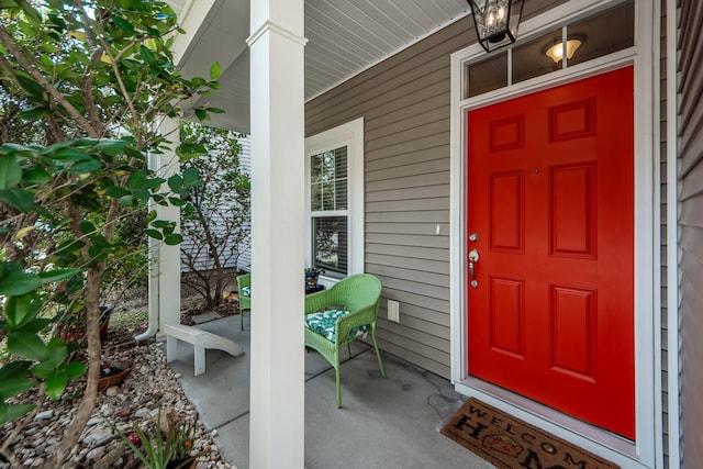 doorway to property featuring covered porch